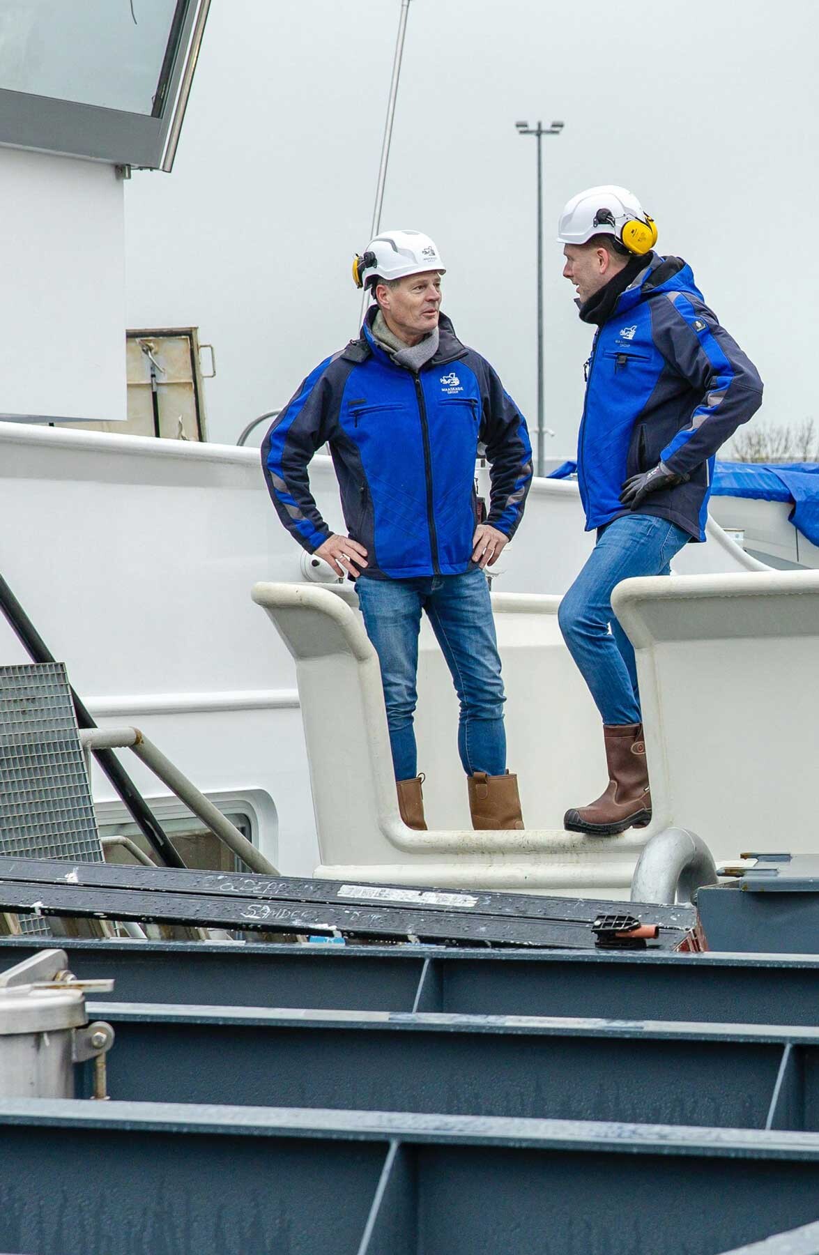 Colleagues on board of barge